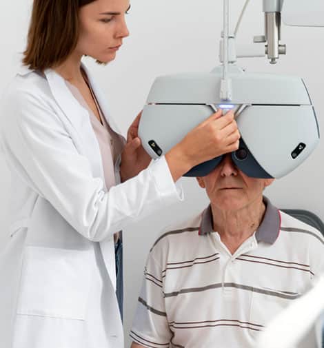 Older man and doctor during eye exam