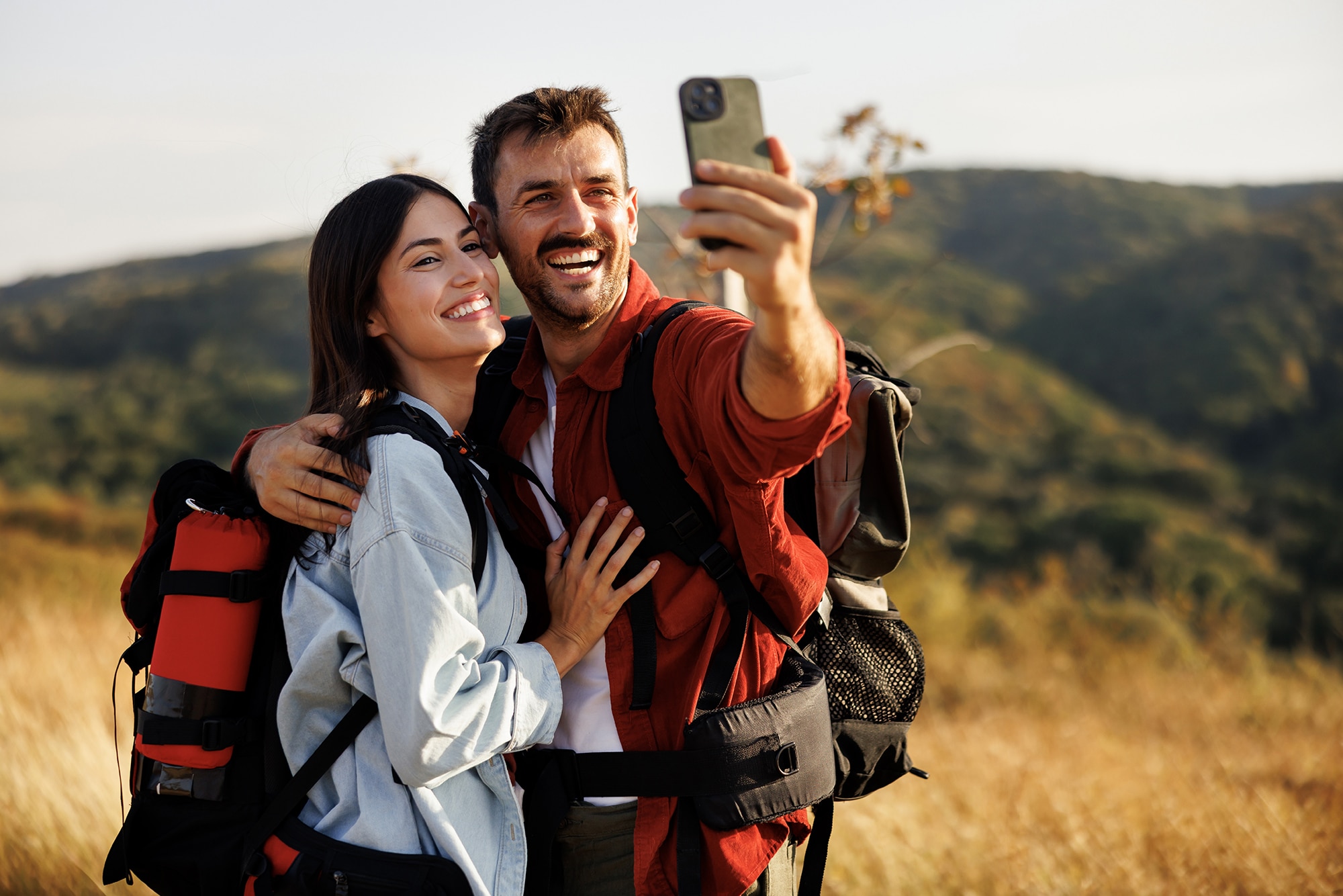 Outdoors couple taking a selfie in nature